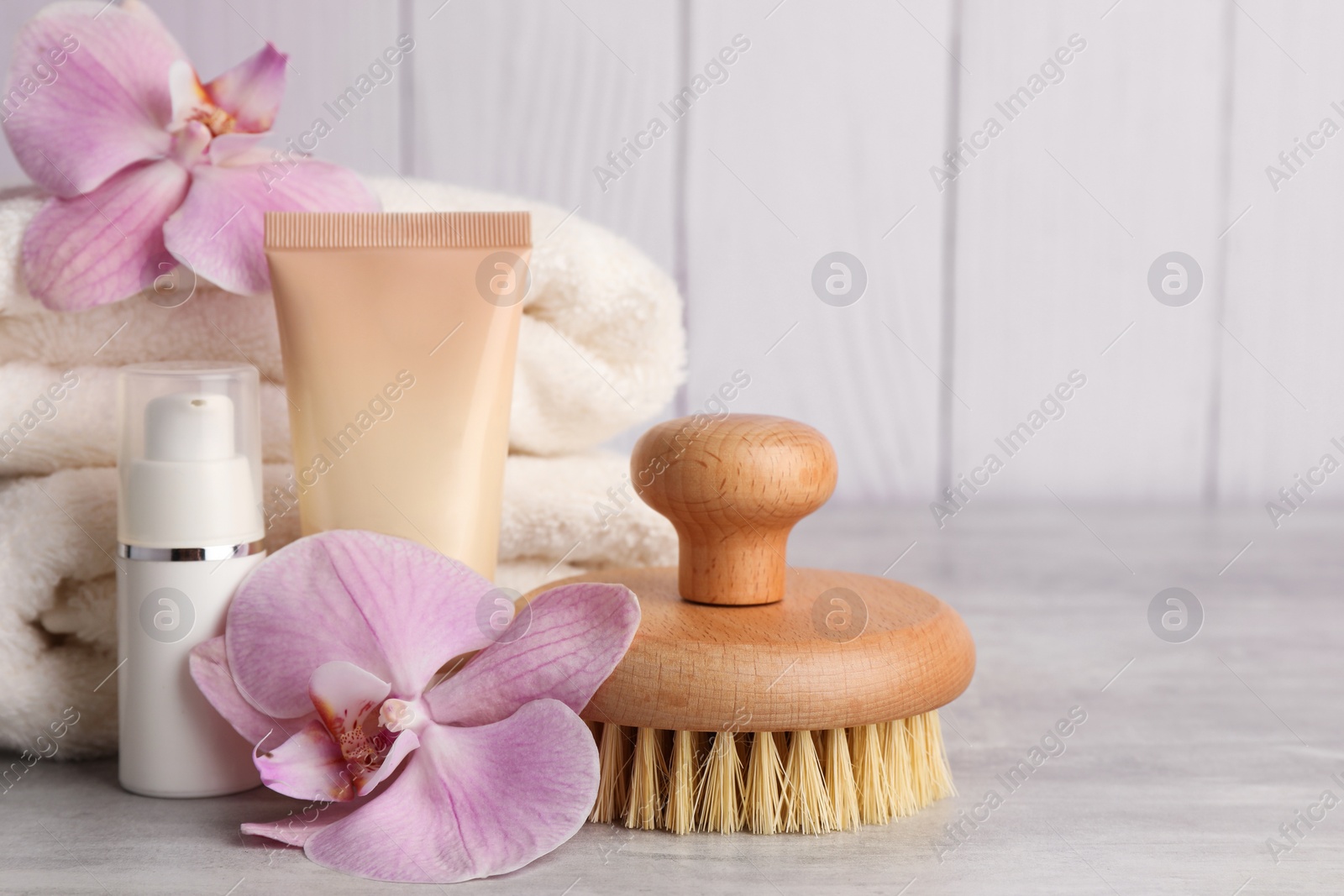 Photo of Beautiful composition with different spa products on light gray table, closeup. Space for text