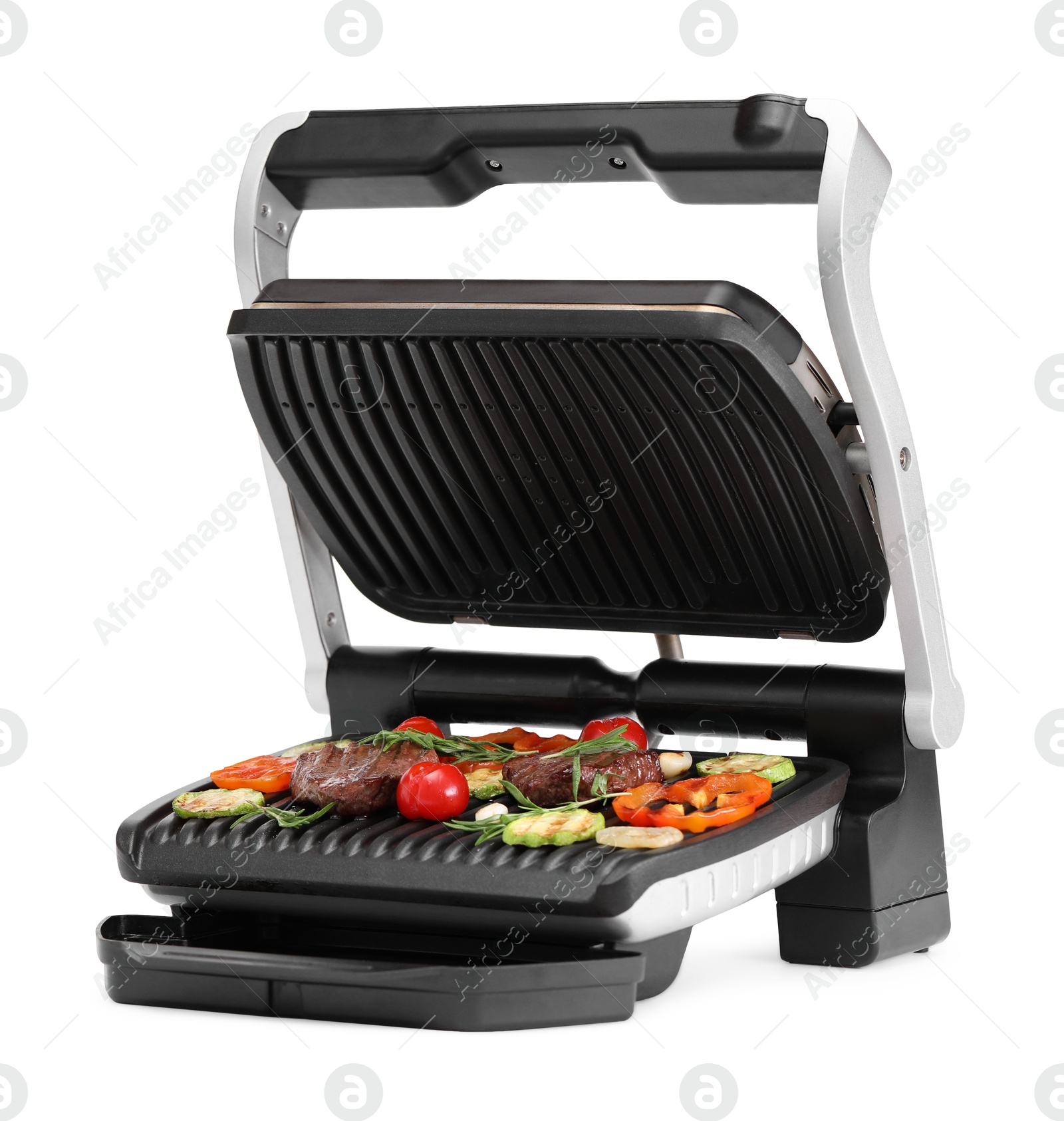 Photo of Electric grill with tasty meat, rosemary and vegetables isolated on white