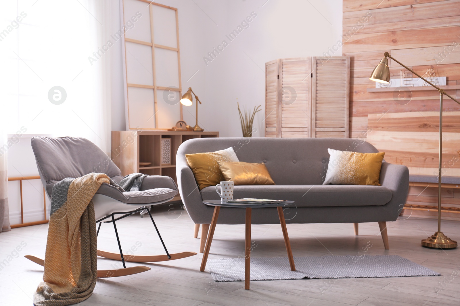 Photo of Stylish living room interior with comfortable sofa. Idea for home decor