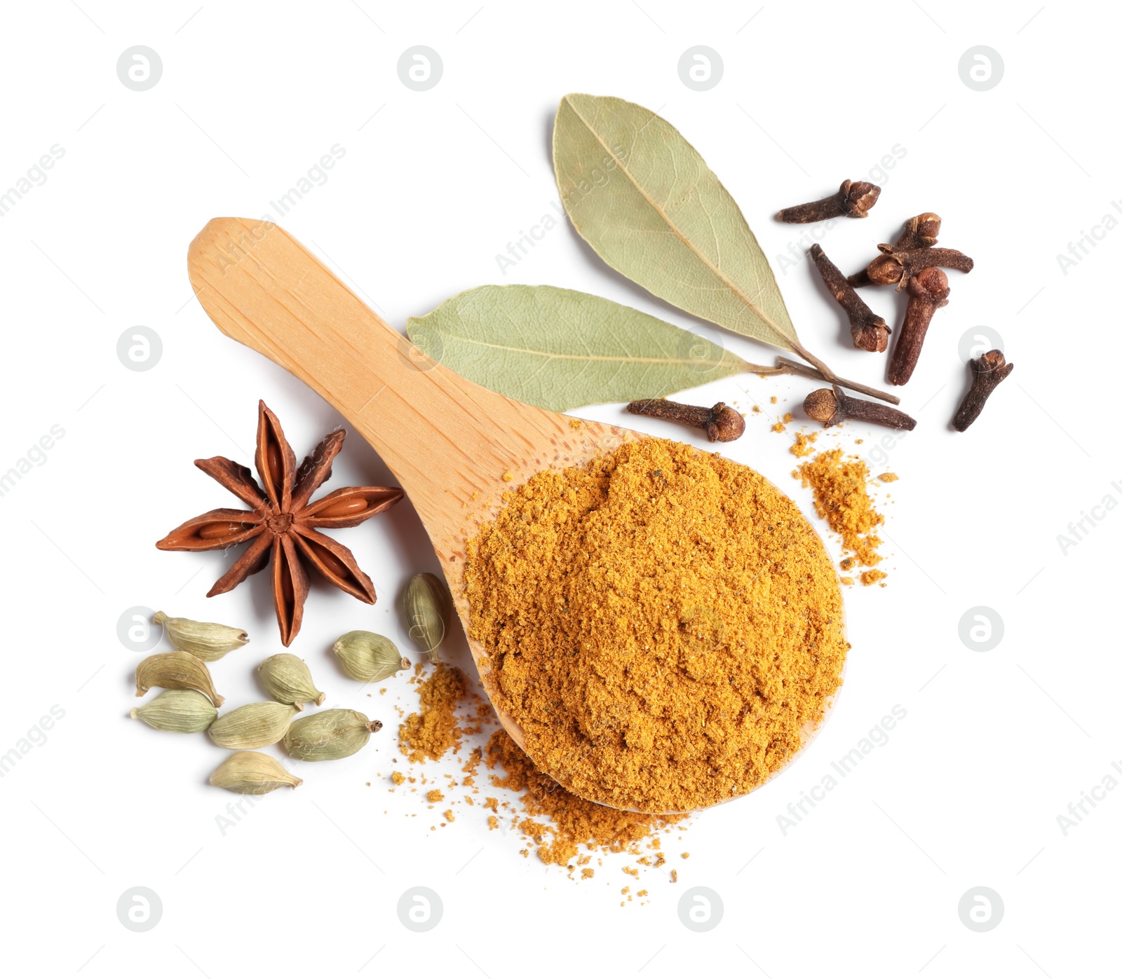 Photo of Spoon with dry curry powder and other spices isolated on white, top view