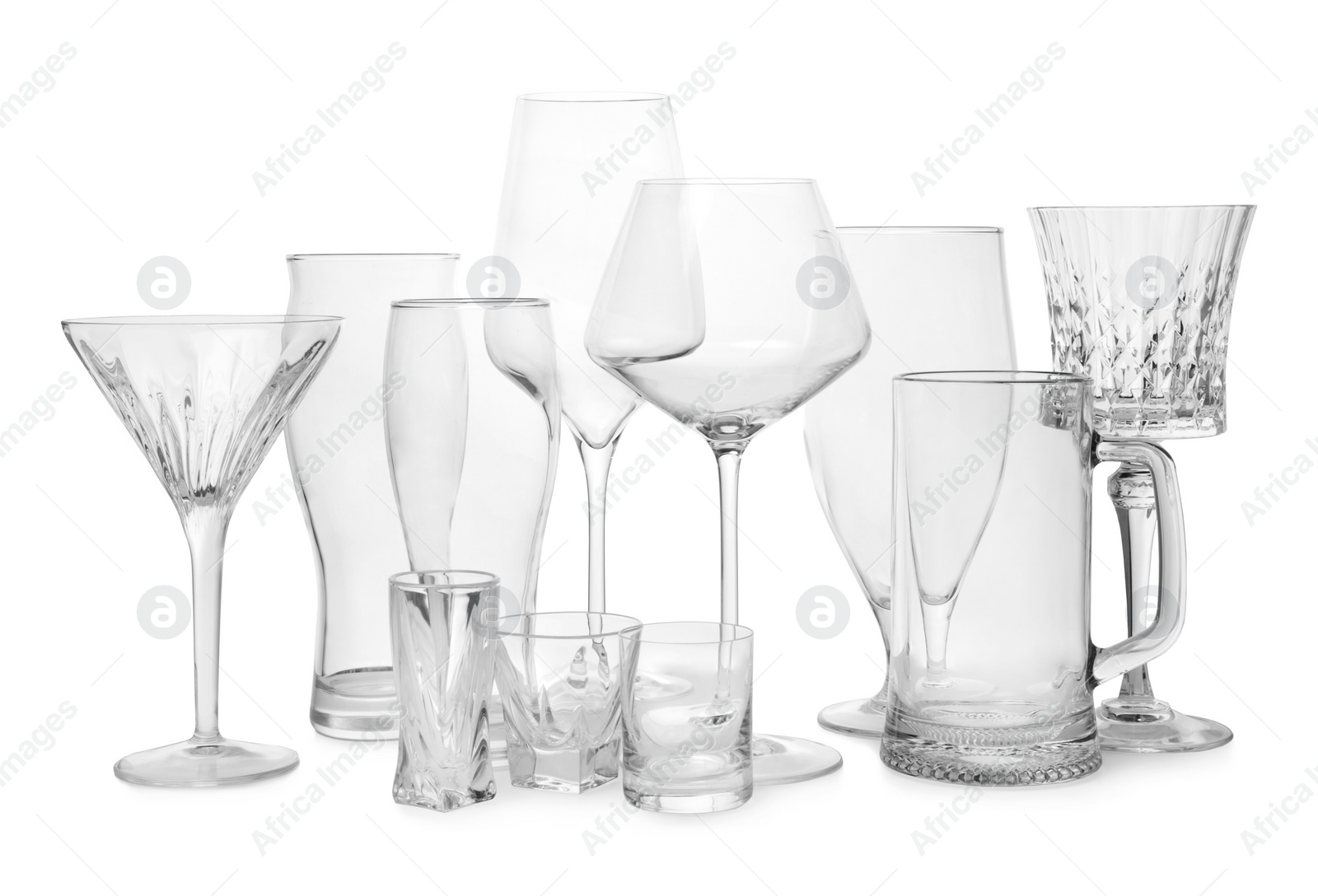 Photo of Different elegant empty glasses isolated on white