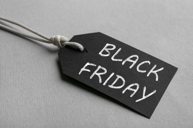 Blank tag on light background, closeup. Black Friday concept