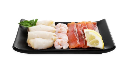 Photo of Sashimi set (raw slices of salmon, oily fish and shrimps) served with lemon and parsley isolated on white