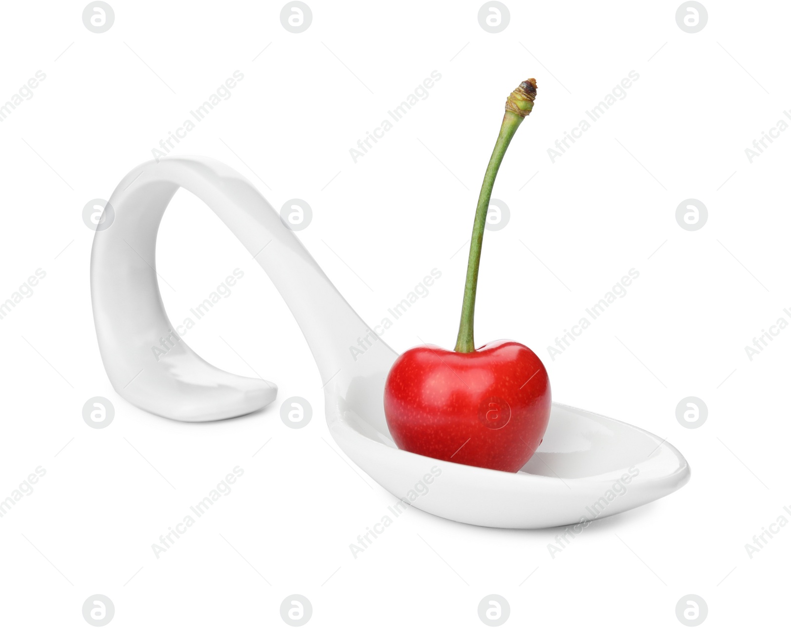 Photo of Spoon with sweet red cherry on white background