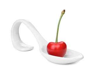 Photo of Spoon with sweet red cherry on white background