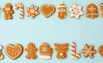 Photo of Different Christmas gingerbread cookies on light blue background, flat lay. Space for text
