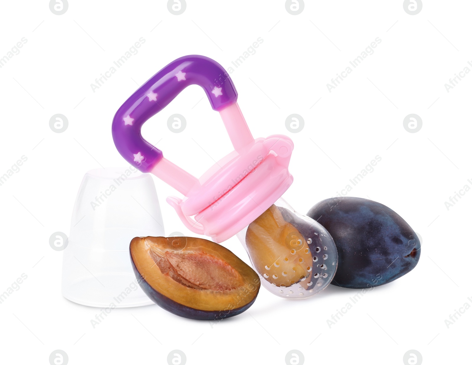 Photo of Nibbler with fresh plum on white background. Baby feeder