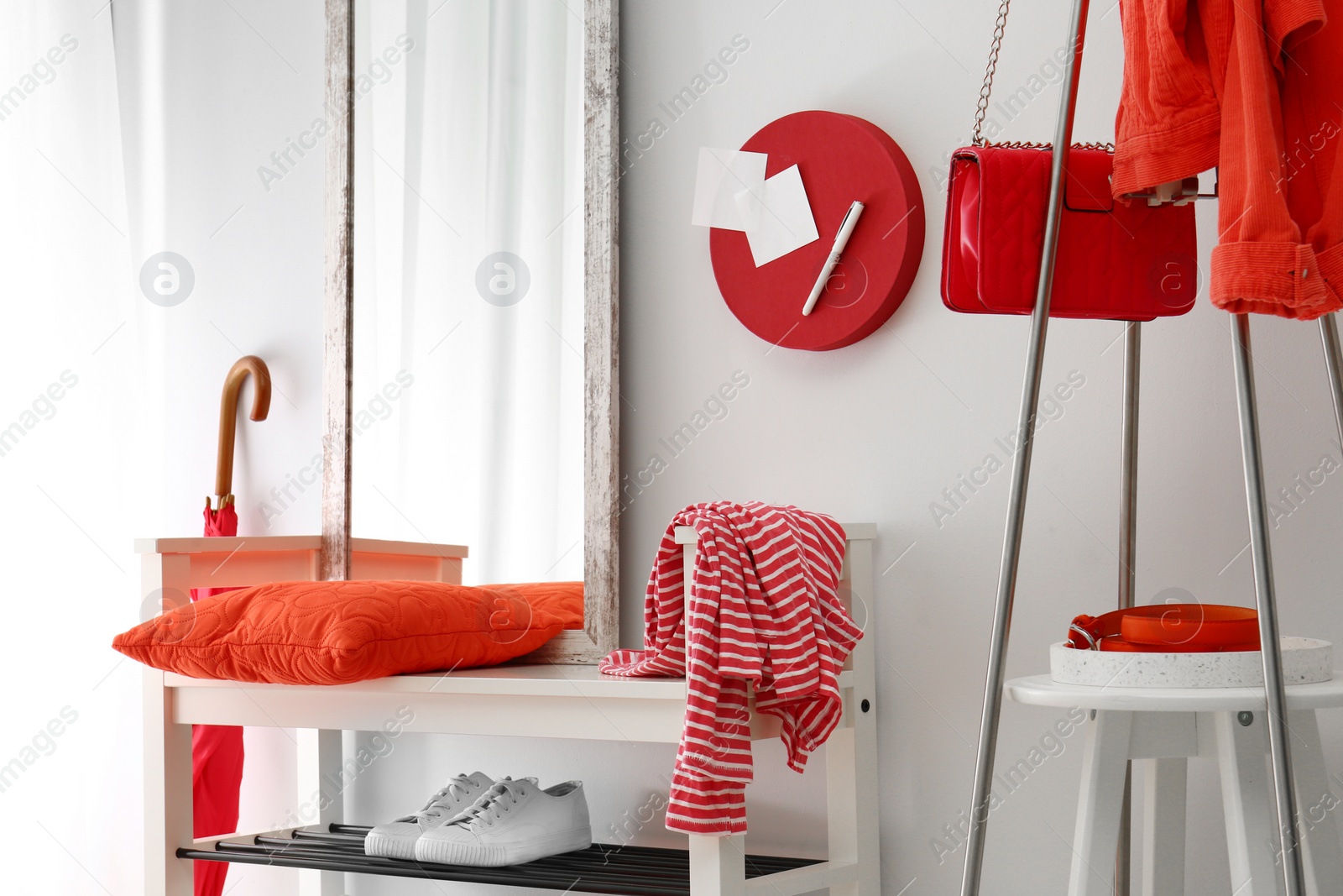 Cozy stylish hallway interior with shoe rack and mirror. Home design idea Photo of Cozy stylish hallway interior with shoe rack and mirror. Home design idea