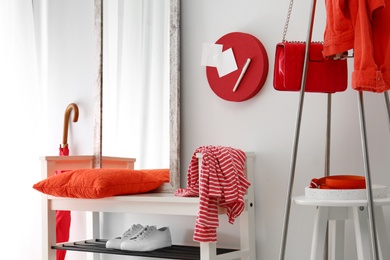 Photo of Cozy stylish hallway interior with shoe rack and mirror. Home design idea