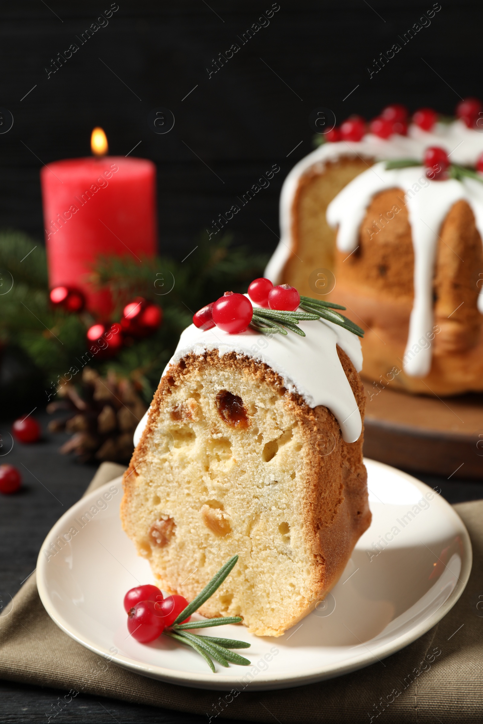 Photo of Piece of traditional homemade Christmas cake on table, closeup