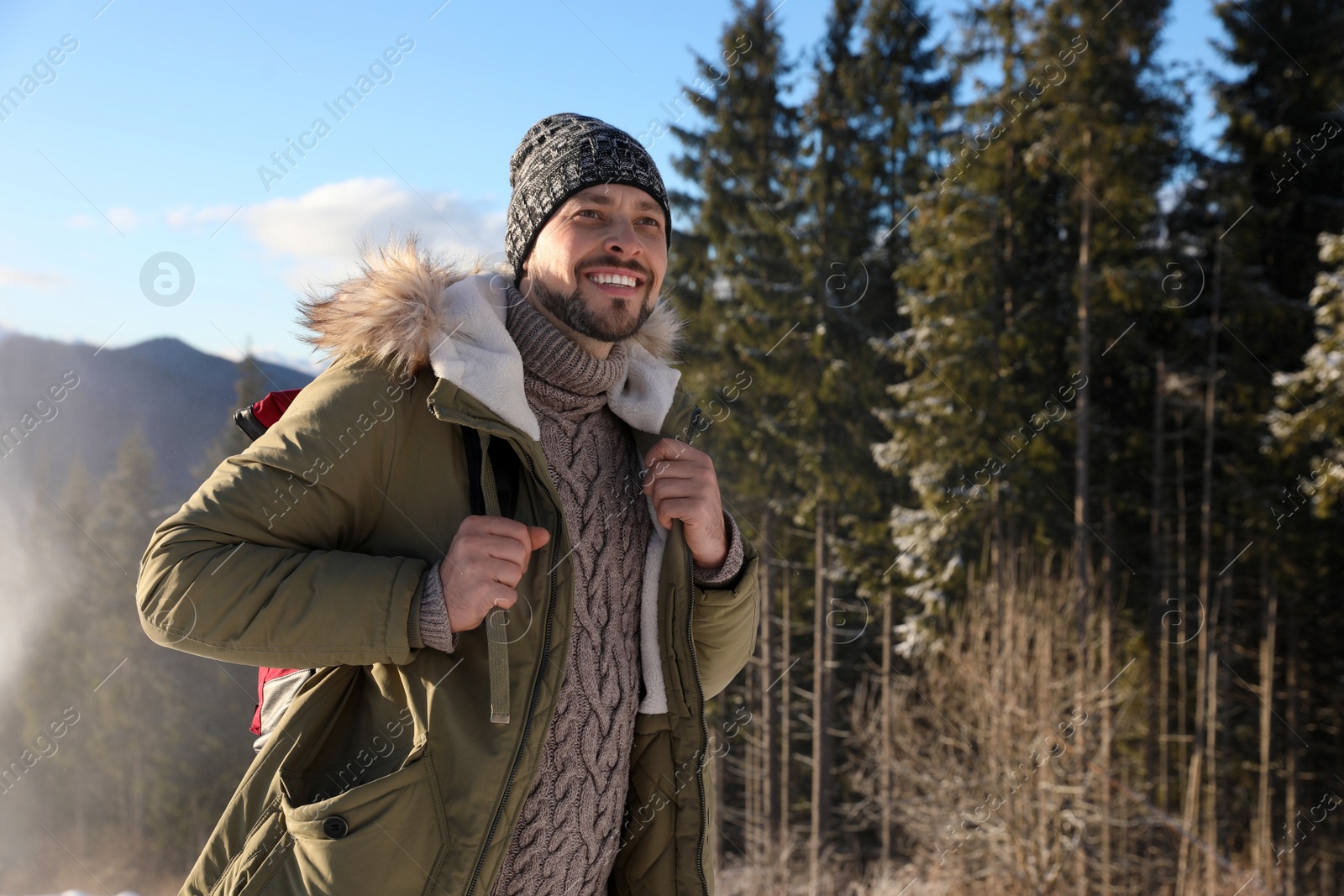 Photo of Man spending winter vacation in mountains. Space for text