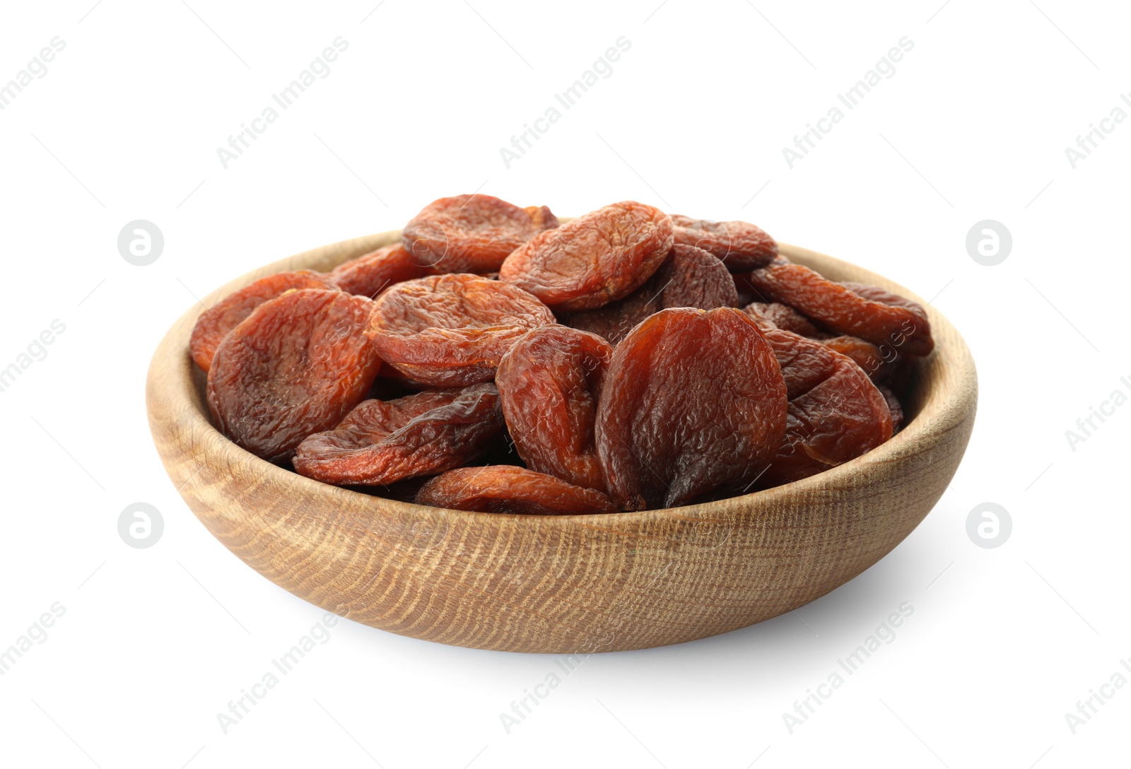 Photo of Wooden bowl with tasty dried apricots isolated on white