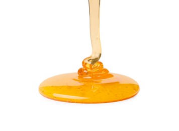 Photo of Pouring tasty natural honey isolated on white