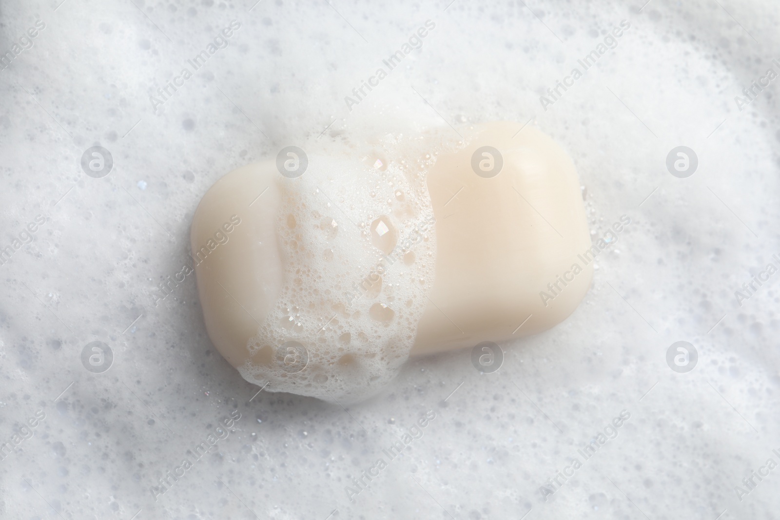 Photo of Top view of soap and fluffy foam