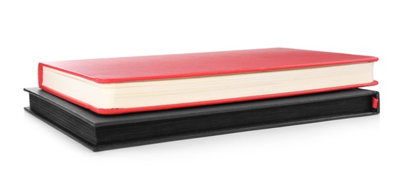 Photo of Stylish red and black notebooks on white background.