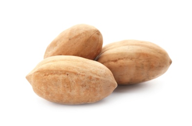 Photo of Pecan nuts in shell on white background. Nutritive food