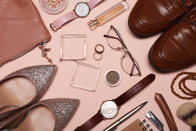 Photo of Flat lay composition with fashionable woman's and man's accessories on pink background