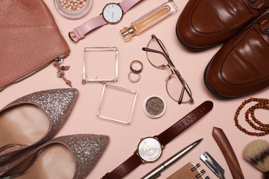 Flat lay composition with fashionable woman's and man's accessories on pink background