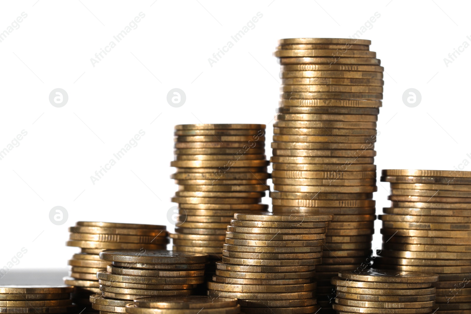 Photo of Stack of coins against white background, closeup