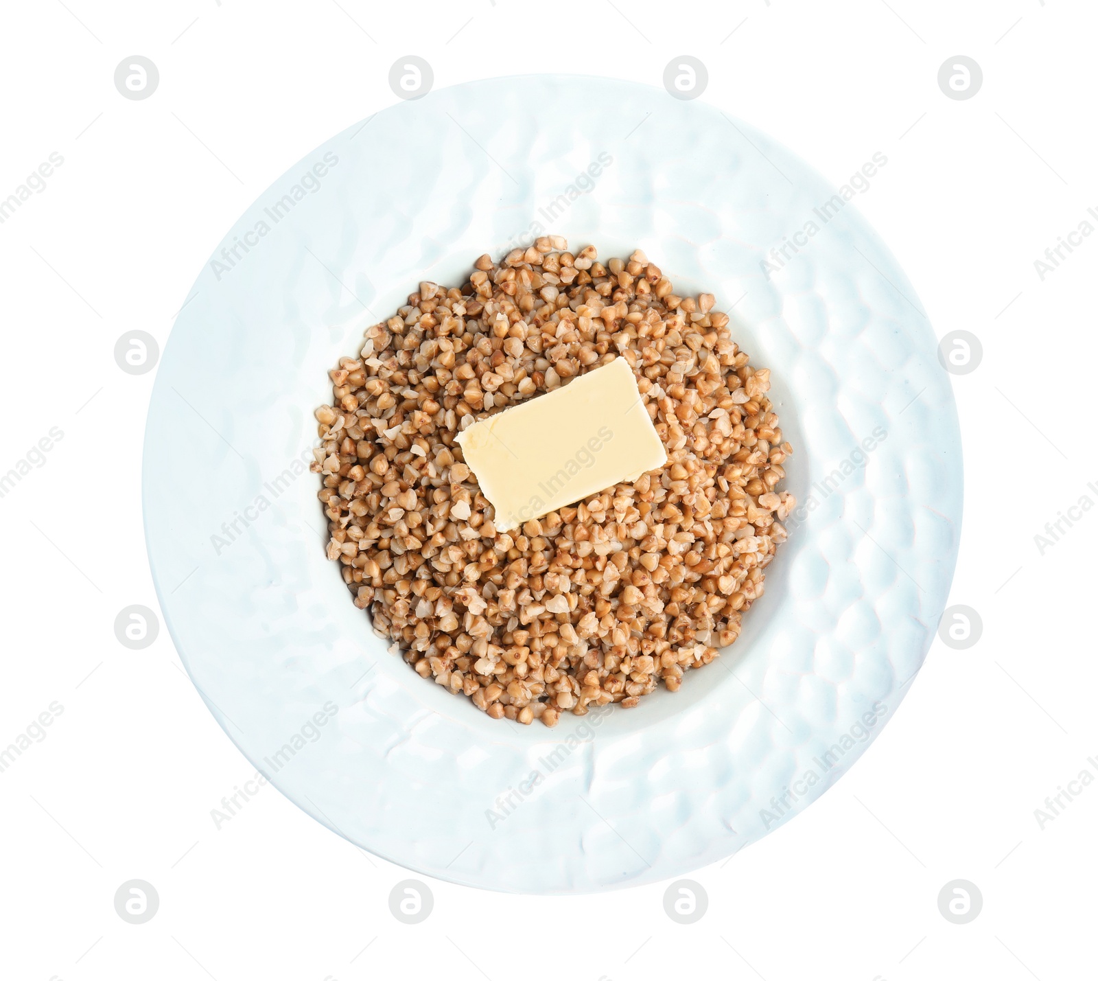 Photo of Plate of buckwheat porridge with butter isolated on white, top view