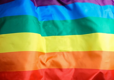 Photo of Bright rainbow gay flag as background. LGBT community