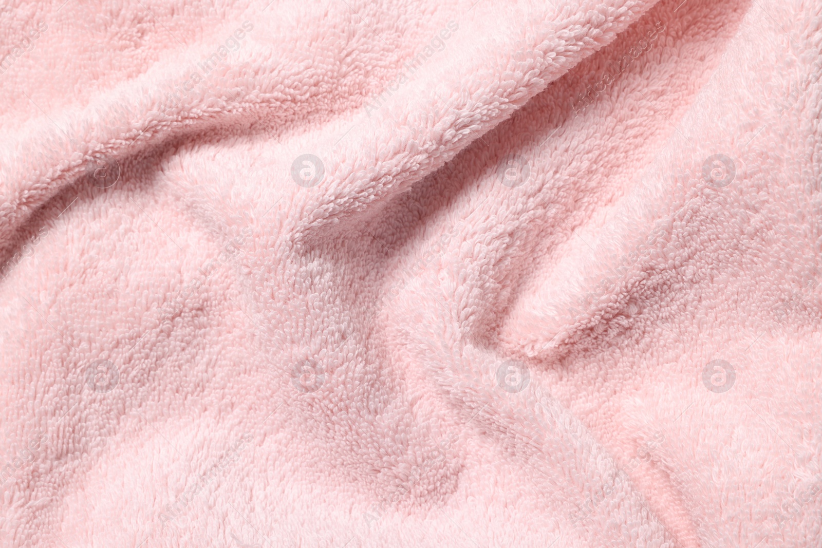 Photo of Texture of pink crumpled fabric as background, top view