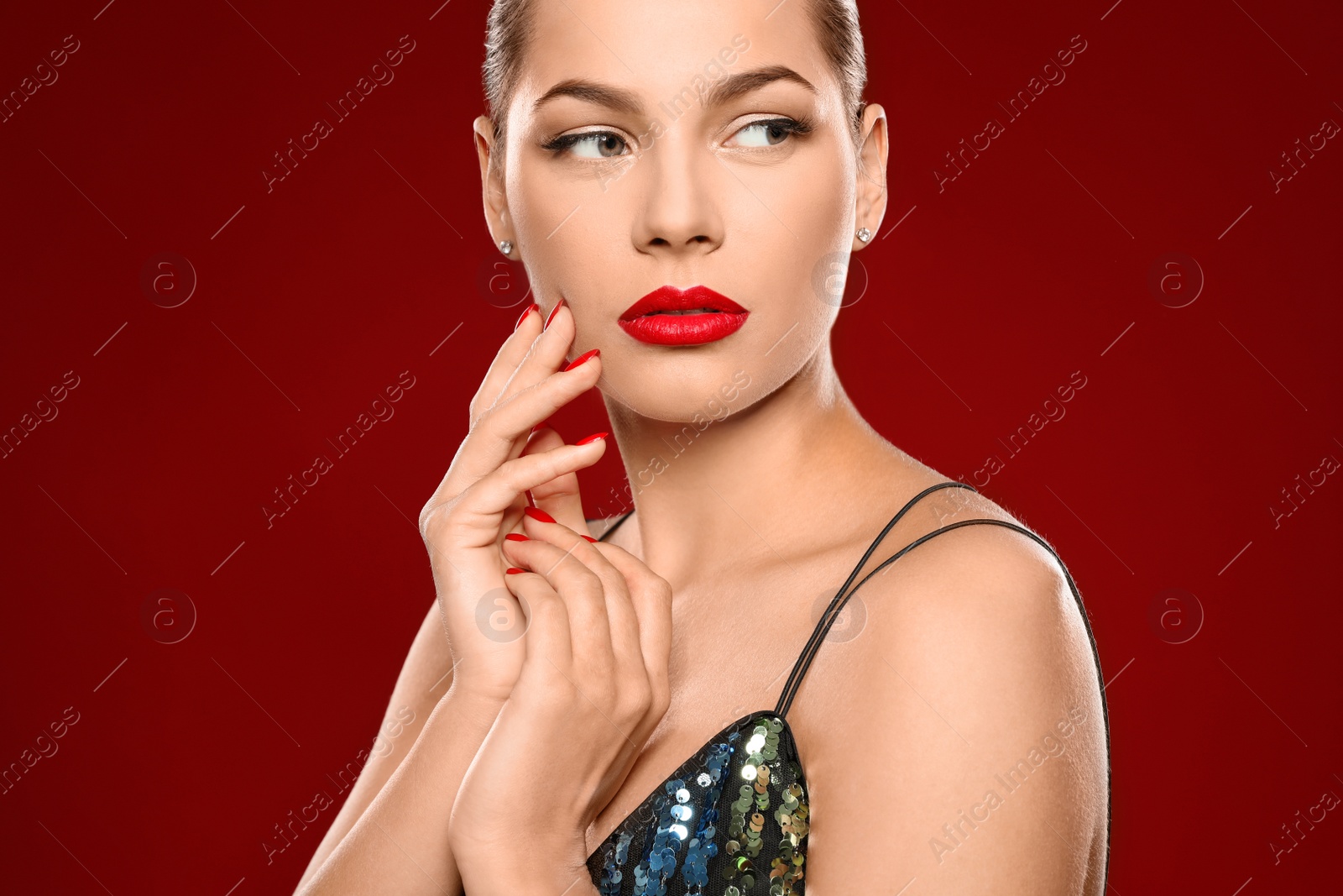 Photo of Beautiful young woman with bright manicure on color background, closeup. Nail polish trends