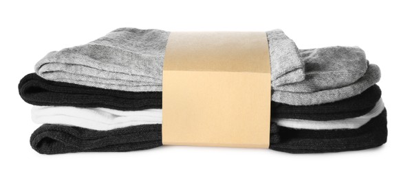 Photo of New pairs of soft cotton socks on white background