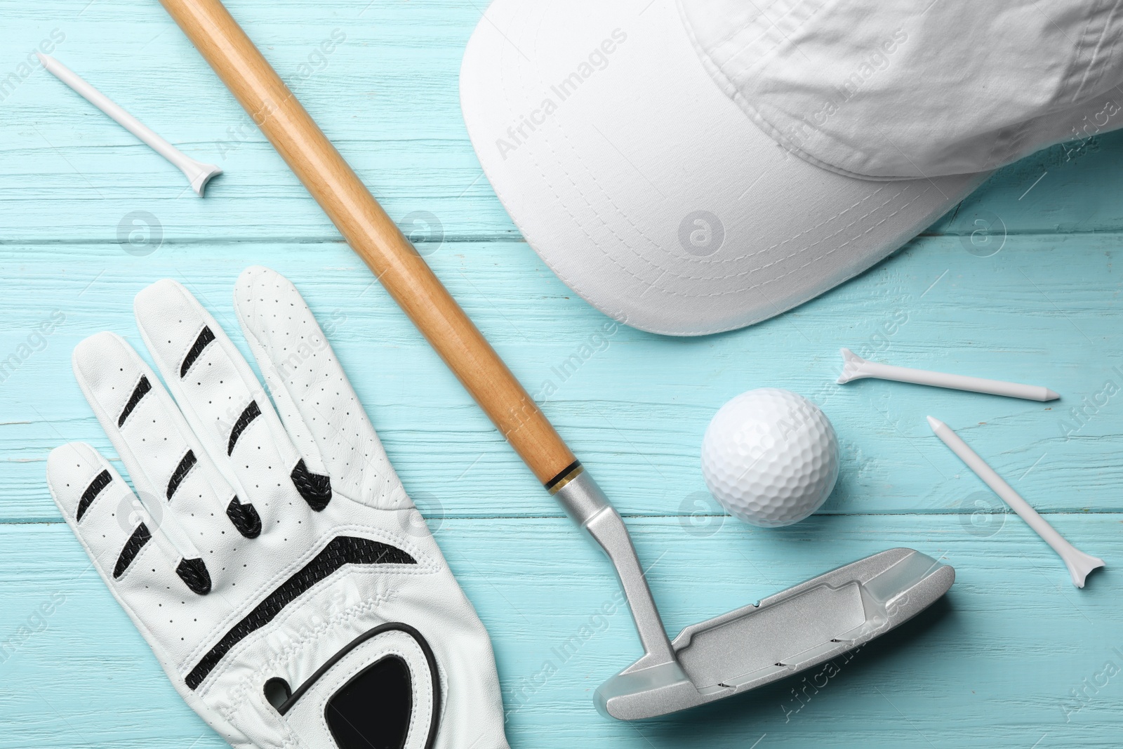 Photo of Flat lay composition with golf accessories on blue wooden background