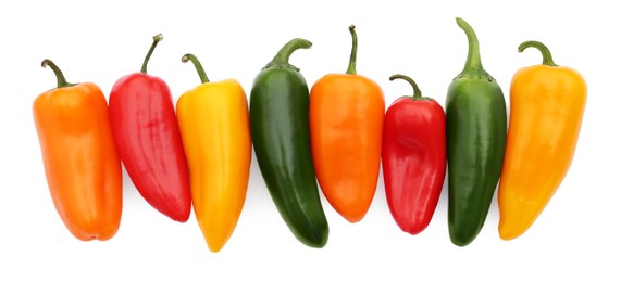 Photo of Different hot chili peppers isolated on white, top view