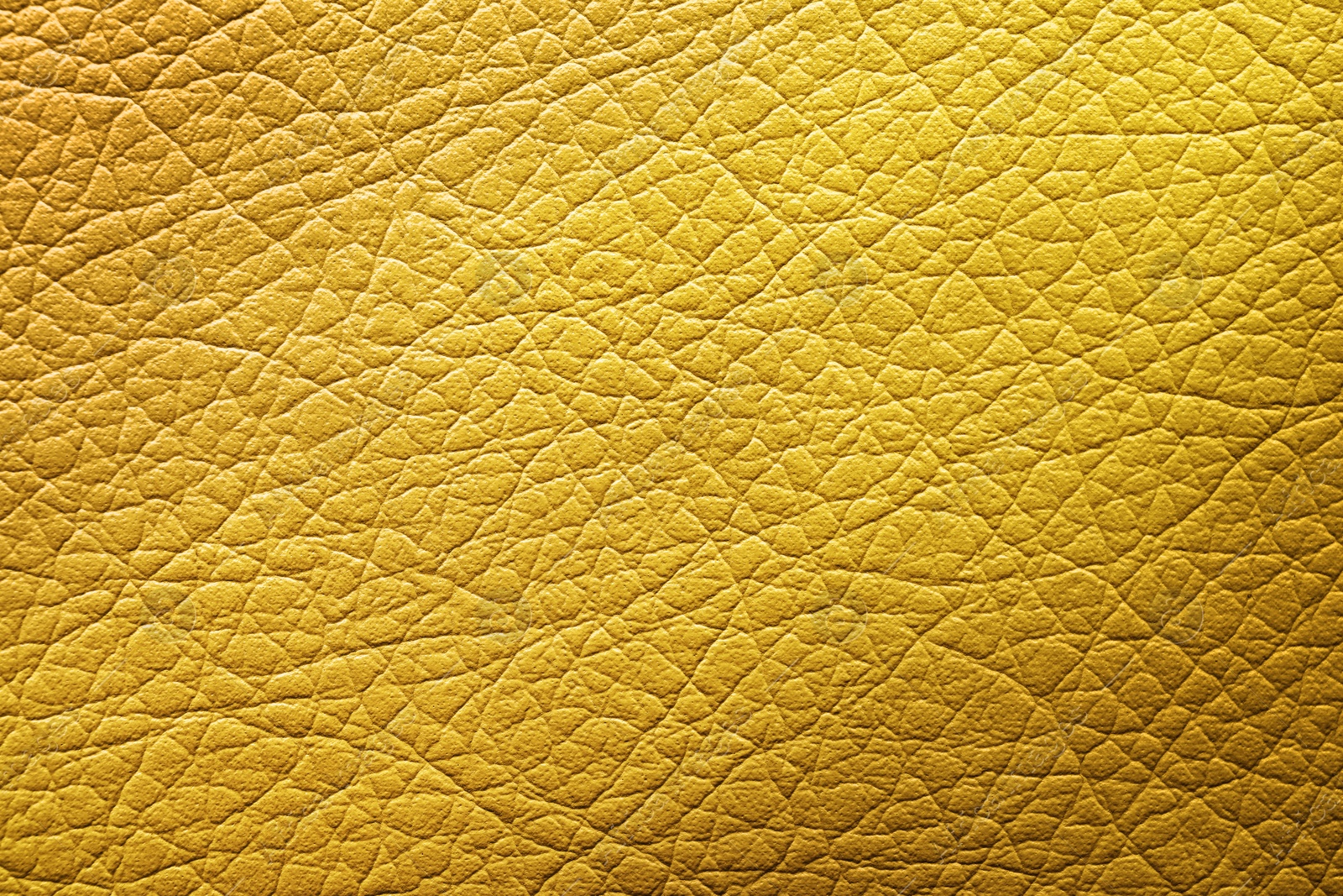 Image of Golden textured surface as background, closeup view