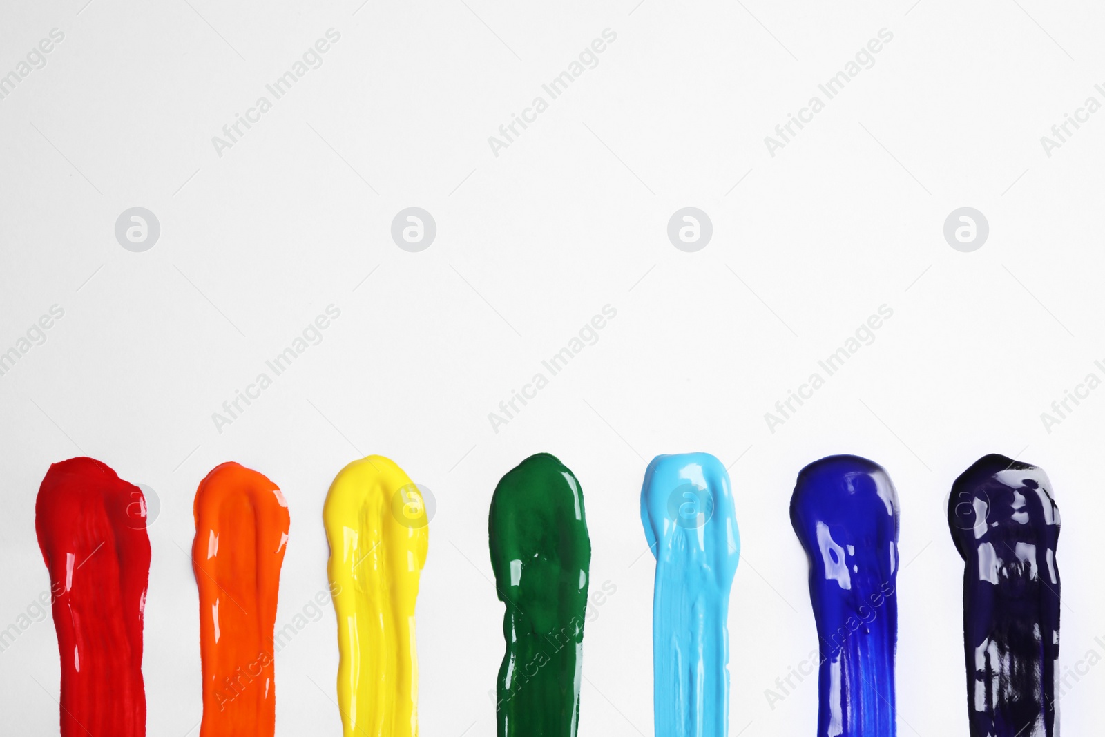 Photo of Bright brush strokes on white background, flat lay. Rainbow colors