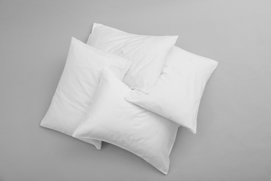 Photo of Clean soft bed pillows on grey background, top view