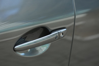 Photo of Closeup view of car door with handle