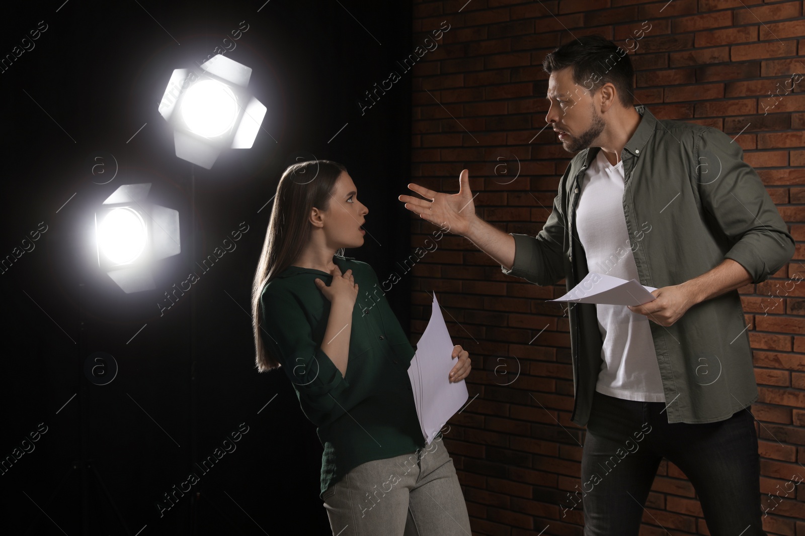 Photo of Professional actors rehearsing on stage in theatre