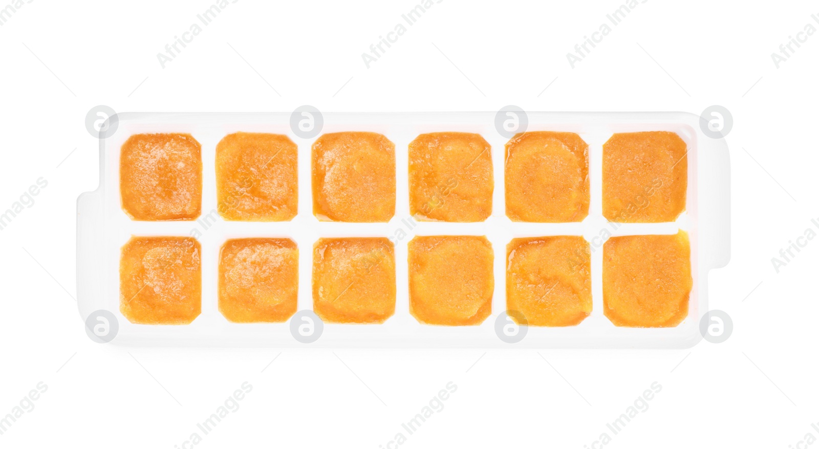 Photo of Puree in ice cube tray on white background, top view. Ready for freezing