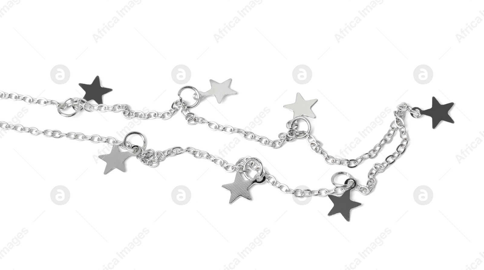 Photo of One metal chain with star pendants isolated on white. Luxury jewelry