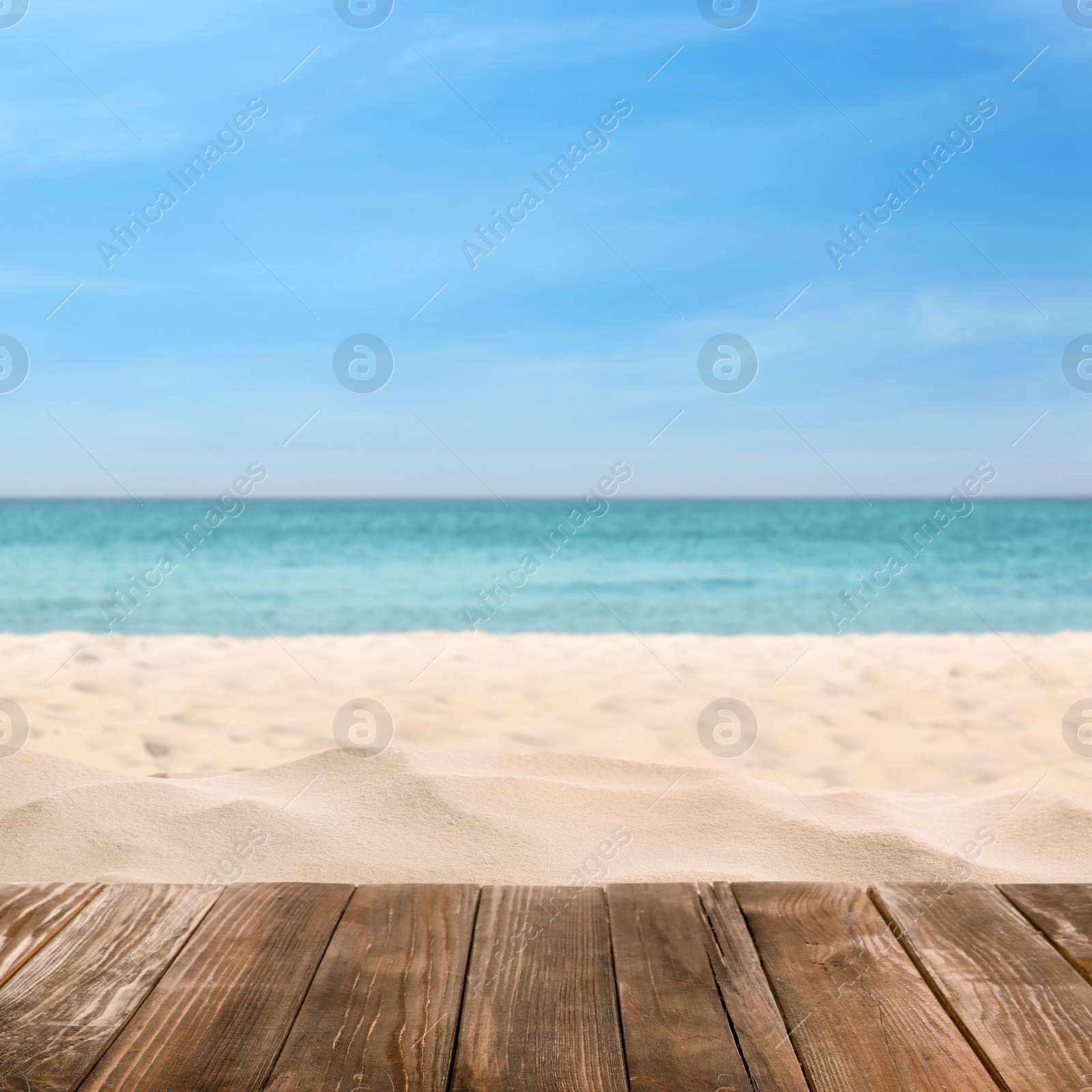 Image of Wooden surface on sandy beach near ocean