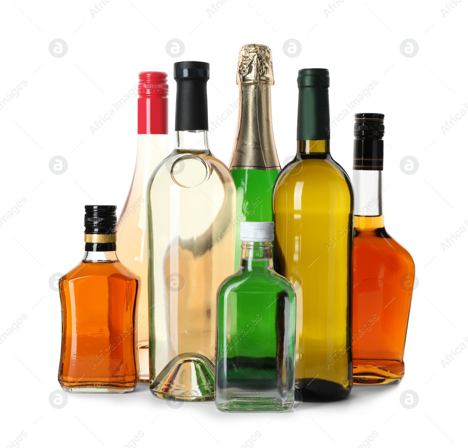 Photo of Bottles with different alcoholic drinks on white background