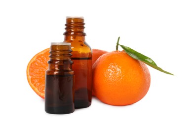 Photo of Aromatic tangerine essential oil in bottles and citrus fruits isolated on white