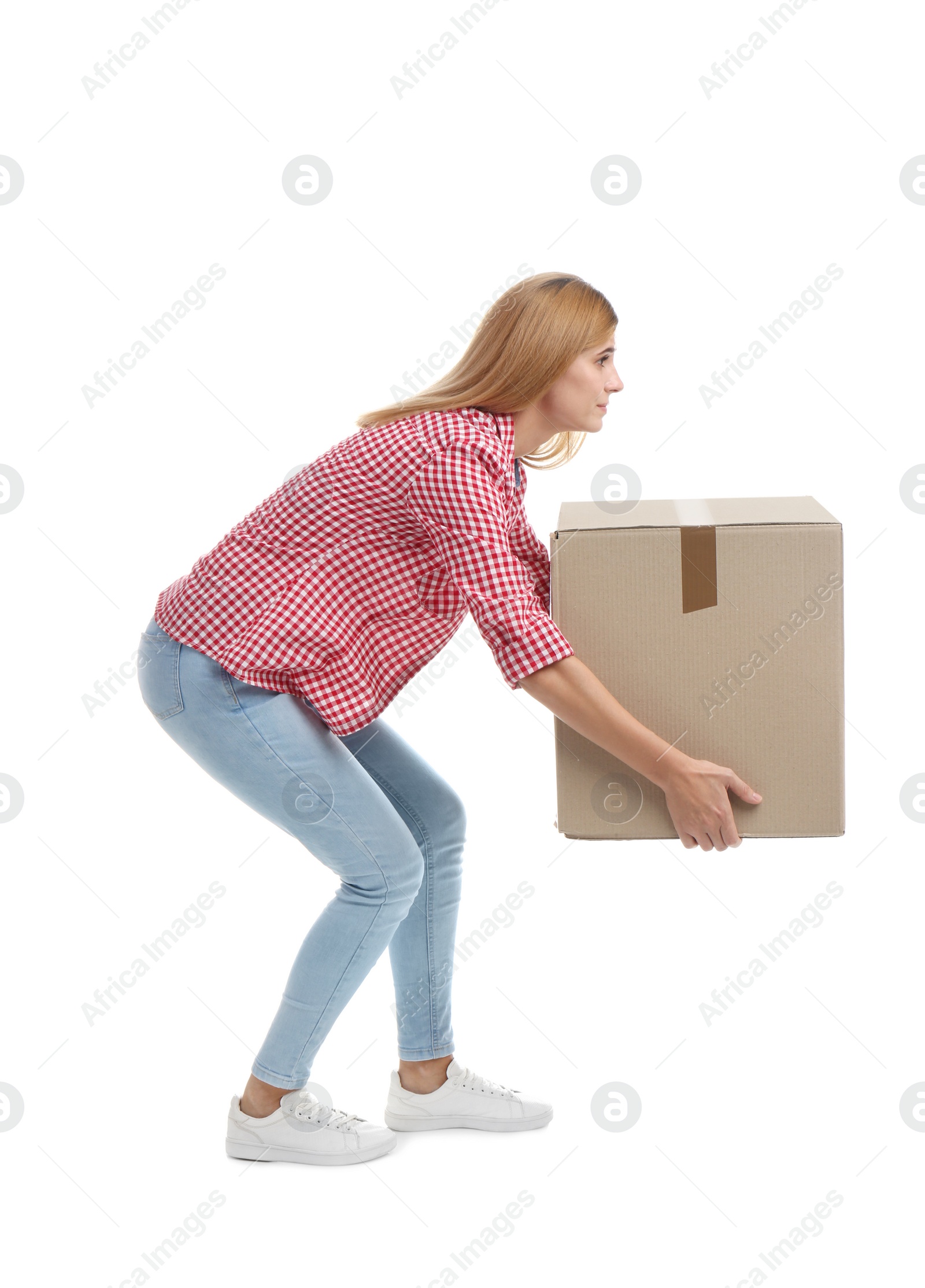 Photo of Full length portrait of woman lifting carton box on white background. Posture concept