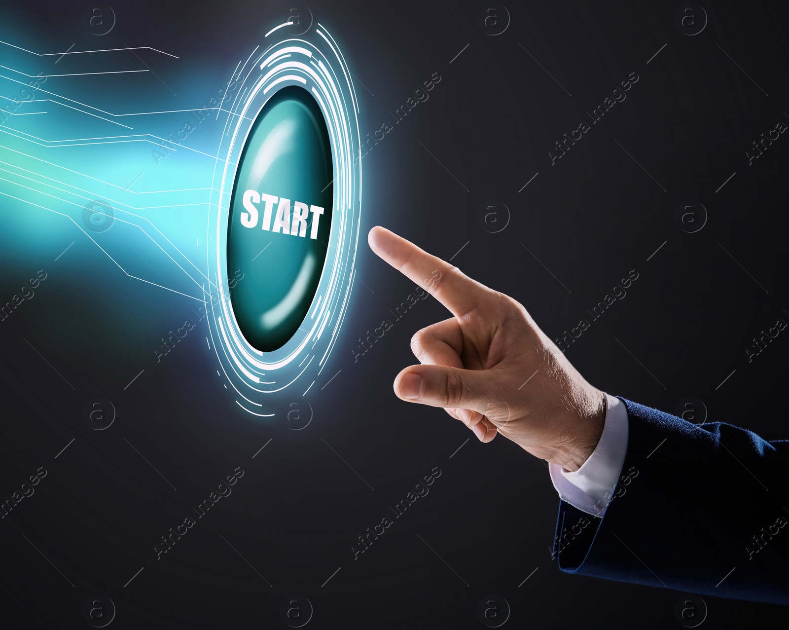 Image of Man pointing at start icon on dark background, closeup