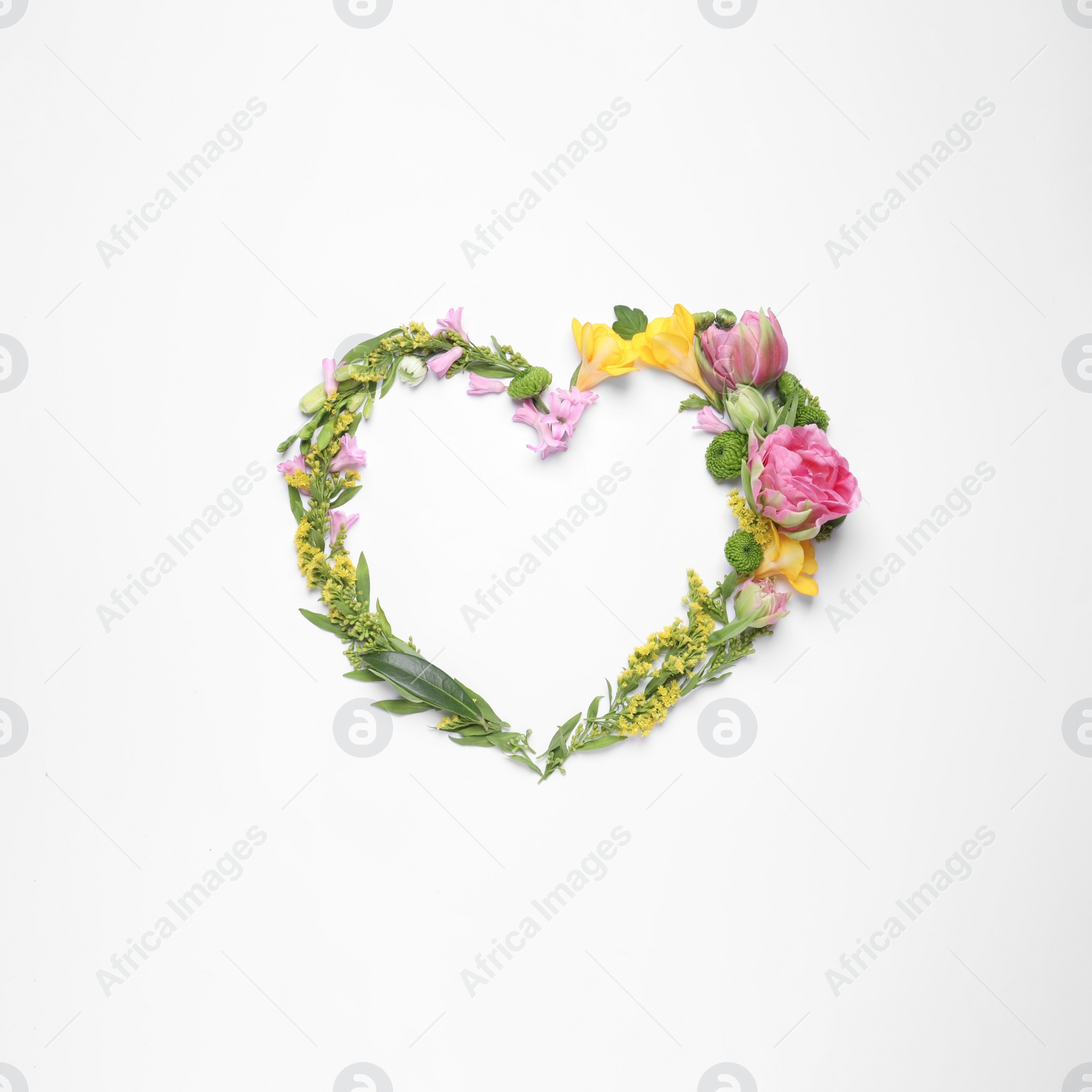 Photo of Beautiful heart made of different flowers on white background, top view