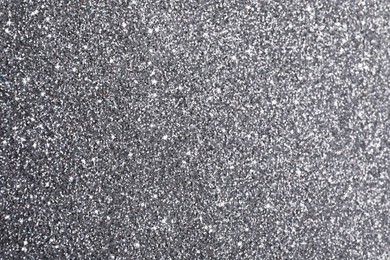 Beautiful shiny grey glitter as background, closeup