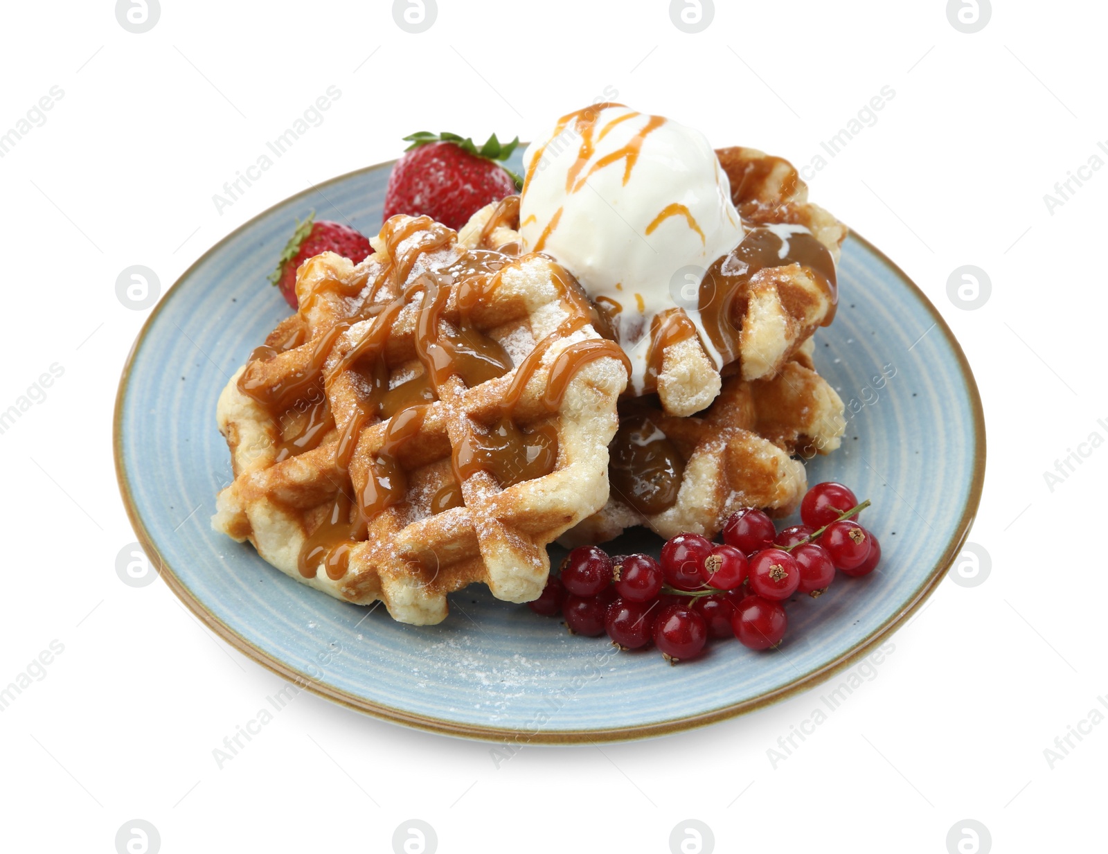 Photo of Tasty Belgian waffles with ice cream, berries and caramel syrup on white background