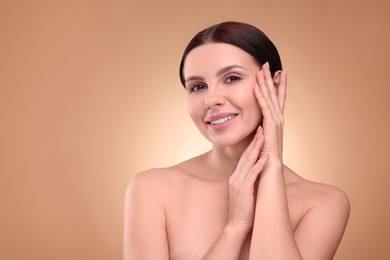 Photo of Beautiful woman with healthy skin on light brown background, space for text. Body Care
