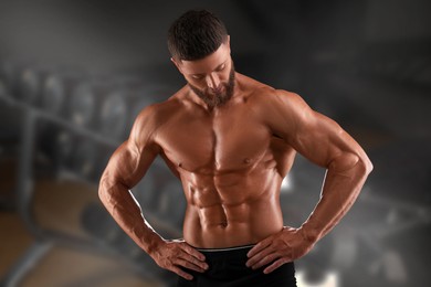 Handsome bodybuilder with muscular body in gym