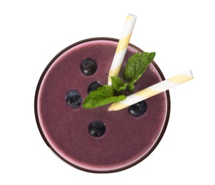 Glass of acai drink with berries on white background, top view