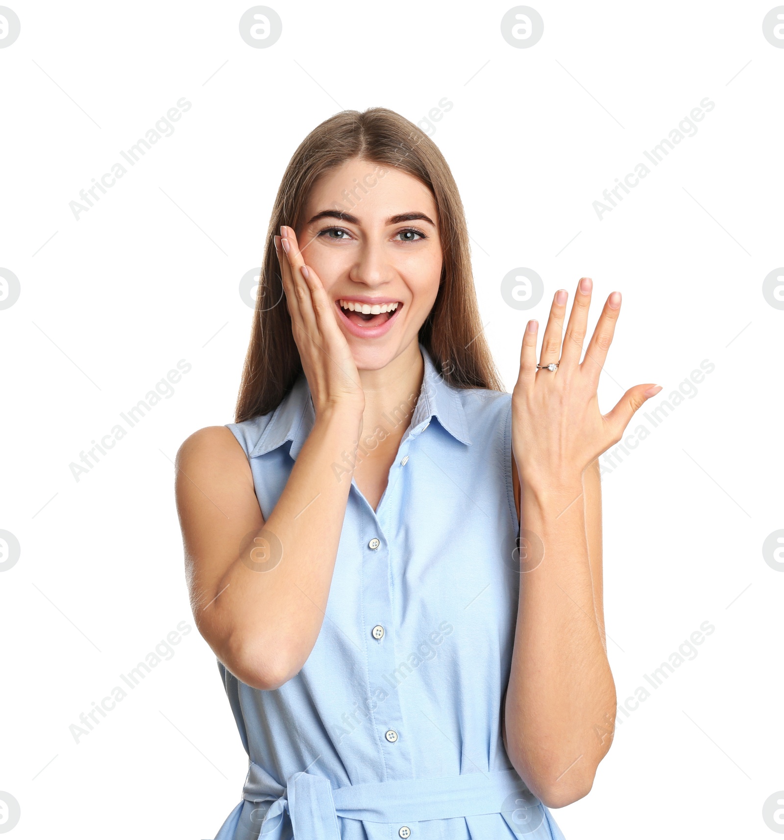 Photo of Happy young woman wearing beautiful engagement ring on white background