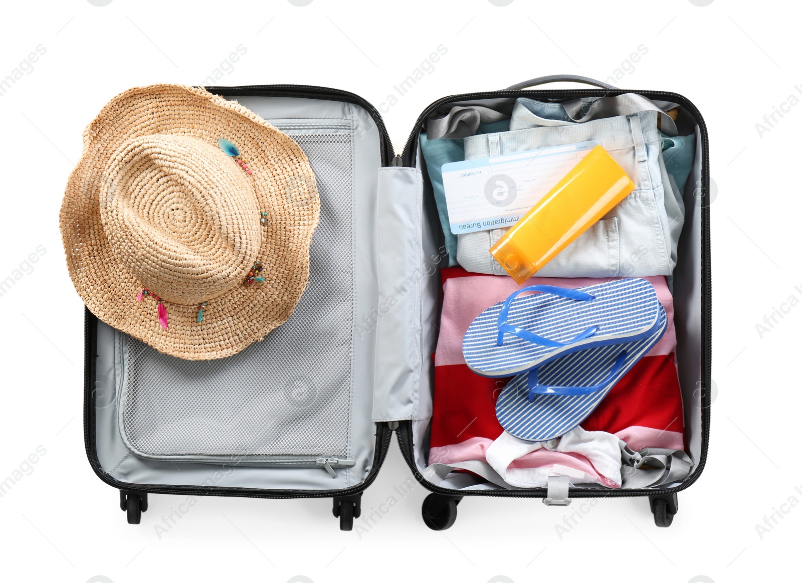 Photo of Packed suitcase with summer clothes on white background, top view